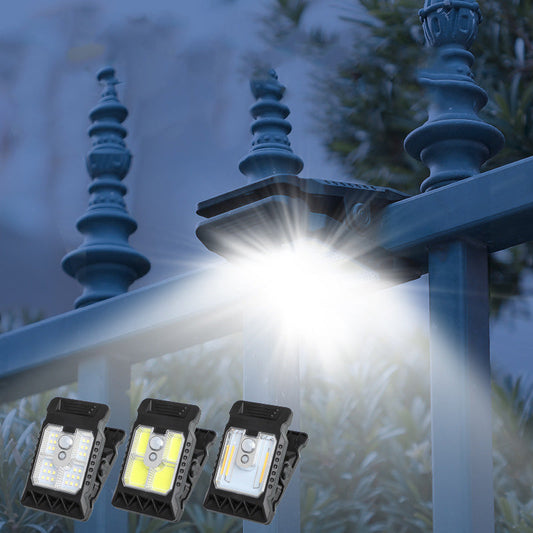 Lámpara solar de exterior con clip y sensor de movimiento.