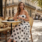 Elegante vestido palabra de honor con volantes y estampado de lunares