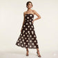 Elegante vestido palabra de honor con volantes y estampado de lunares